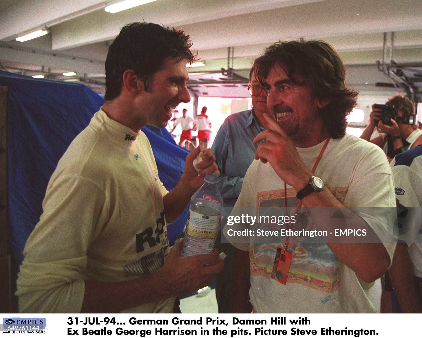 Damon Hill with George Harrison in the pits on 31 July 1994. 