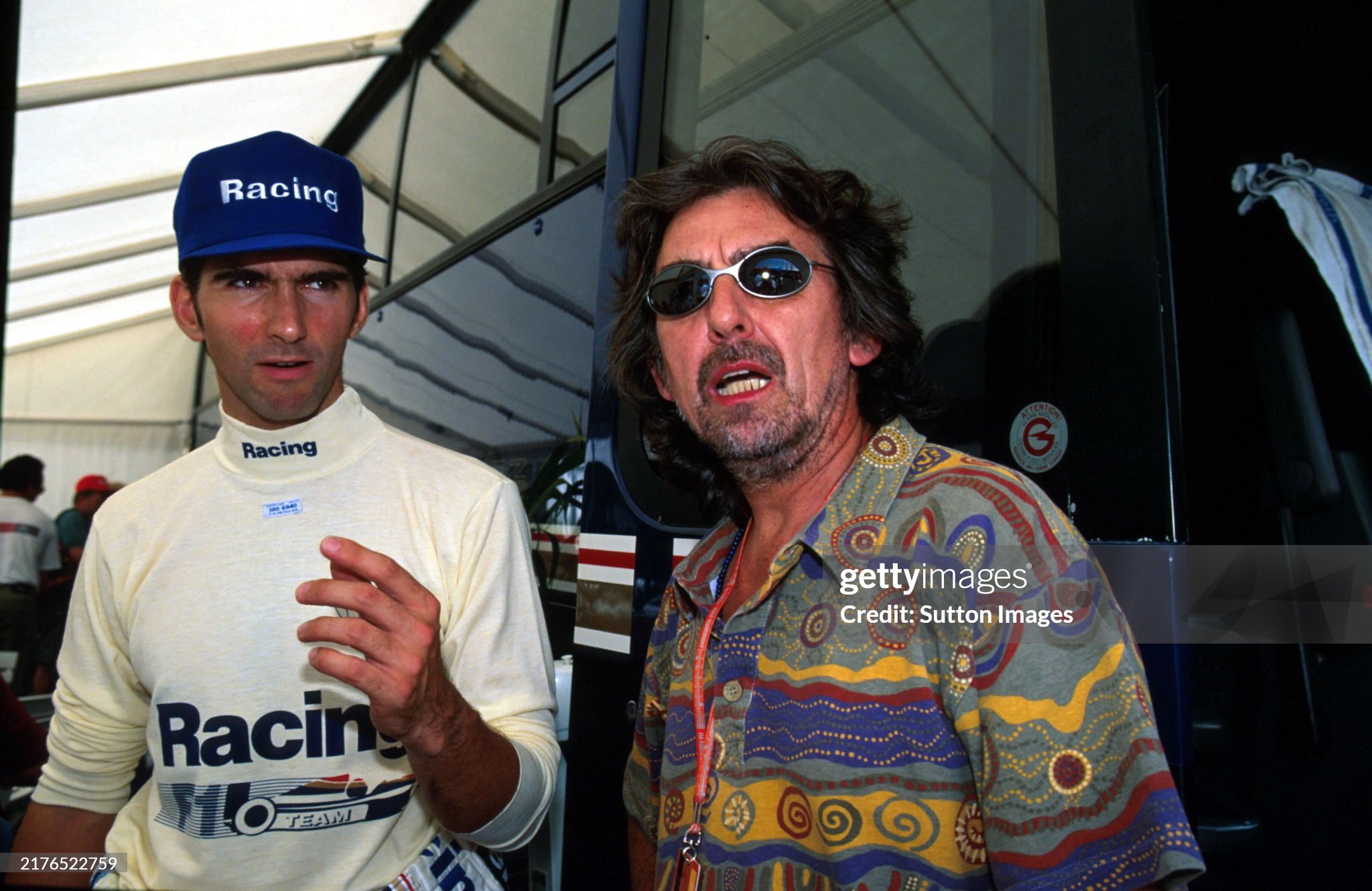 Beatles star George Harrison talks with Damon Hill on 31 July 1994. 