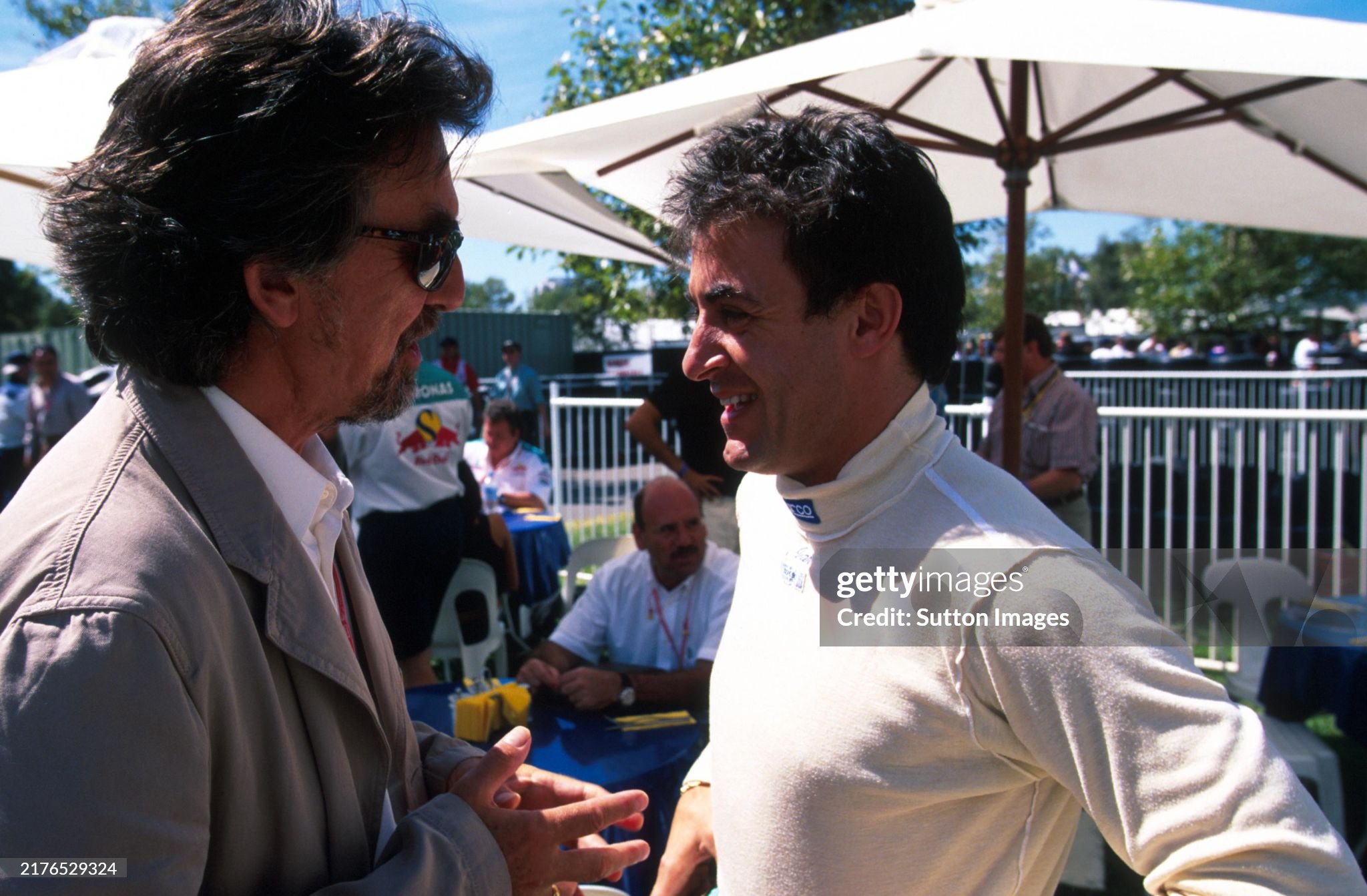 George Harrison talks to Jean Alesi at the Australian Grand Prix in Melbourne on 07 March 1999. 
