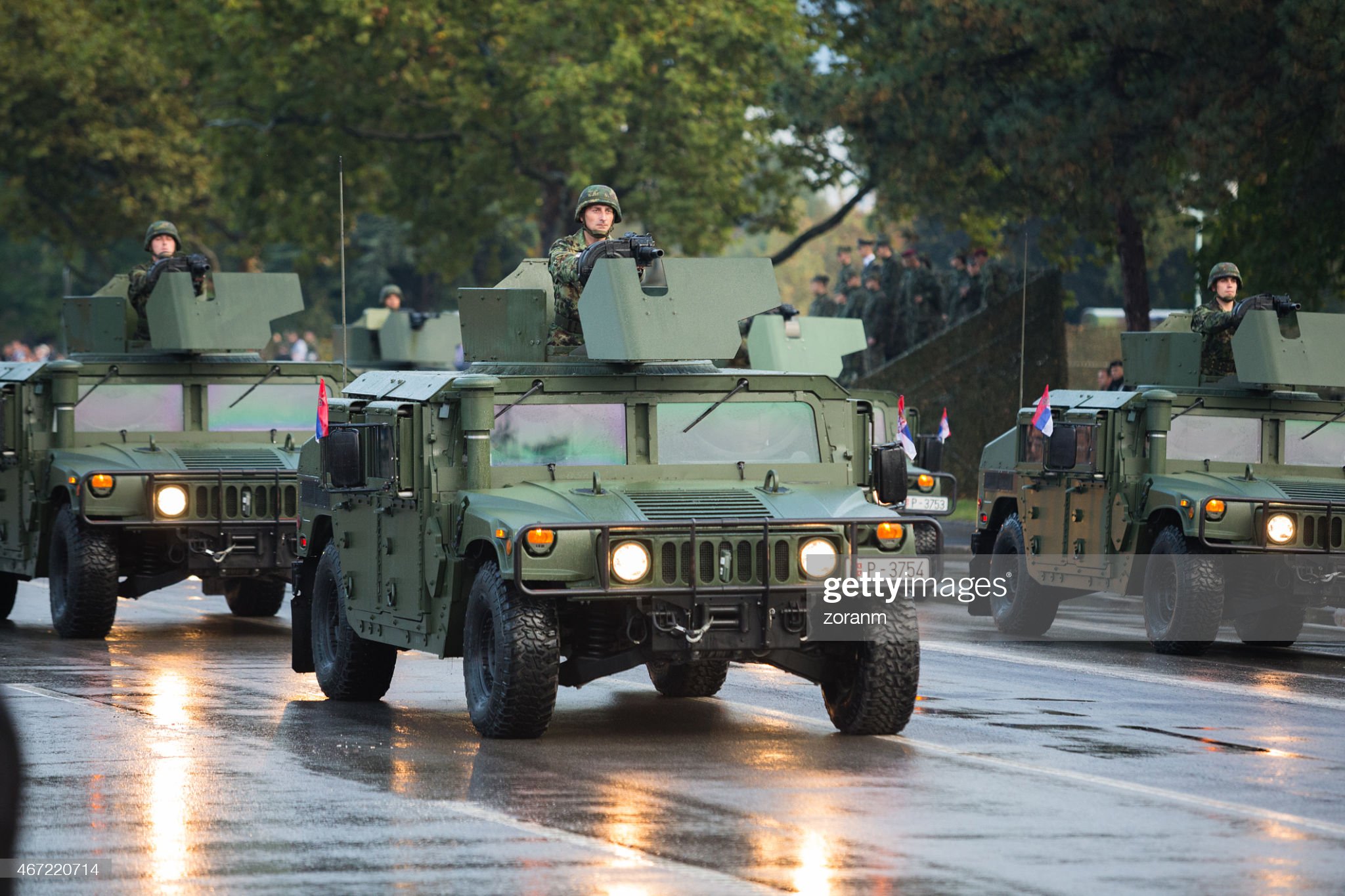 October 16, 2014: Serbian military in Hummer vehicles equipped with automated granade launcher, participating in military parade held in Belgrade.
