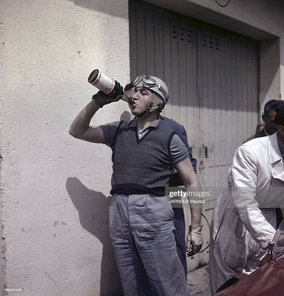 Alberto Ascari drinks from a bottle in 1948.