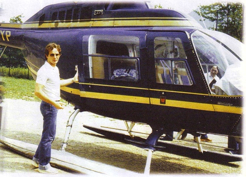 Gilles Villeneuve in front of his helicopter.