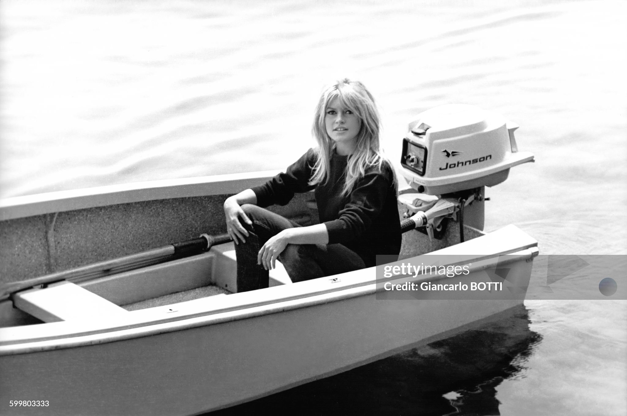Brigitte Bardot sitting in a boat in 1962 in Saint-Tropez, France. 