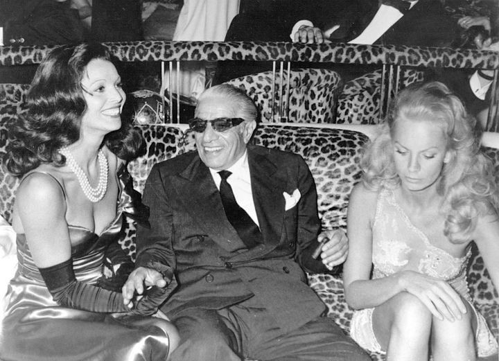 Elsa Martinelli, Aristotle Onassis and Odile Rodin during a party given by Florence Grinda at the club ‘Le Prive’ in Paris on 17 June 1974.