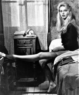 Brigitte Bardot in a Paris room putting on her Nylon stockings in the 1958 movie ‘Love is my profession’. 