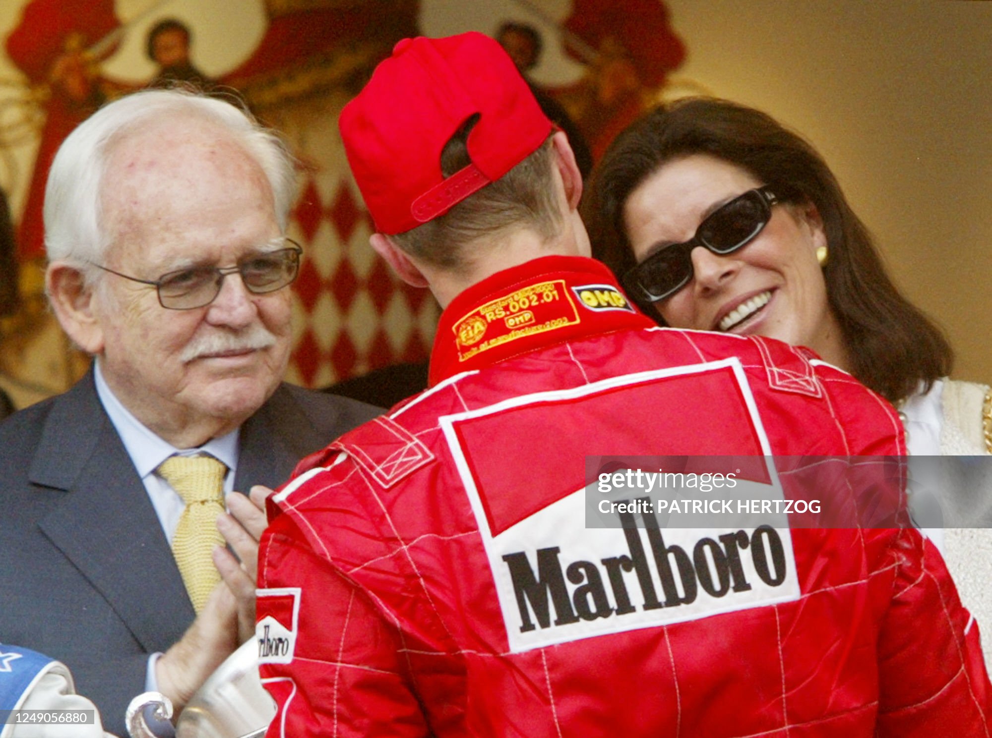 German Ferrari driver Michael Schumacher is congratulated by Prince Rainier III of Monaco and his daughter Princess Caroline on the podium of the Monaco racetrack, 01 June 2003 after the Monaco Formula One Grand Prix.