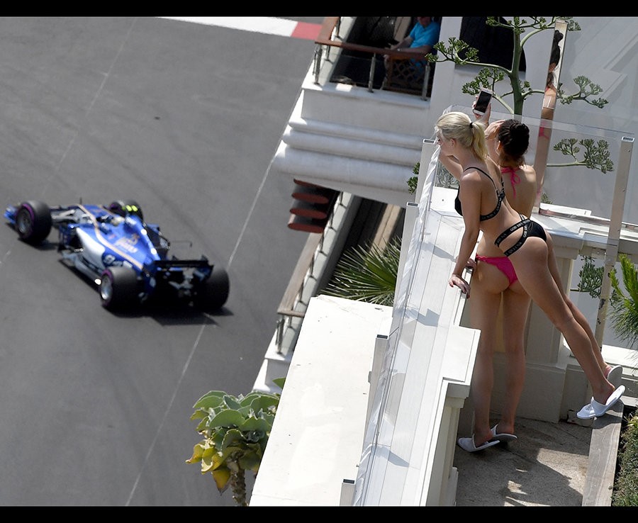A pair of F1 fans wear sexy underwear to watch the race. 