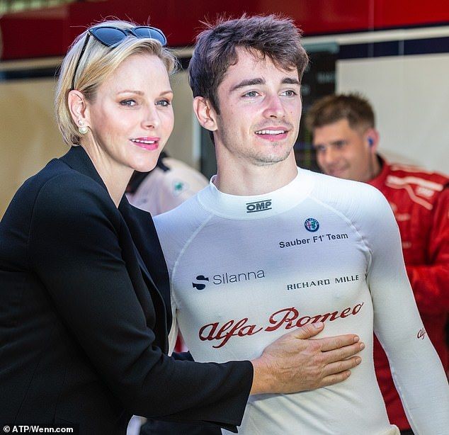 Princess Charlene posed for pictures with Monaco born driver Charles Leclerc, 21, at the Sauber garages in Abu Dhabi.