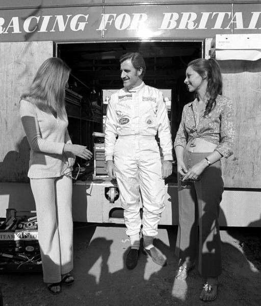 Graham Hill and vintage grid girls in Spain in 1969.