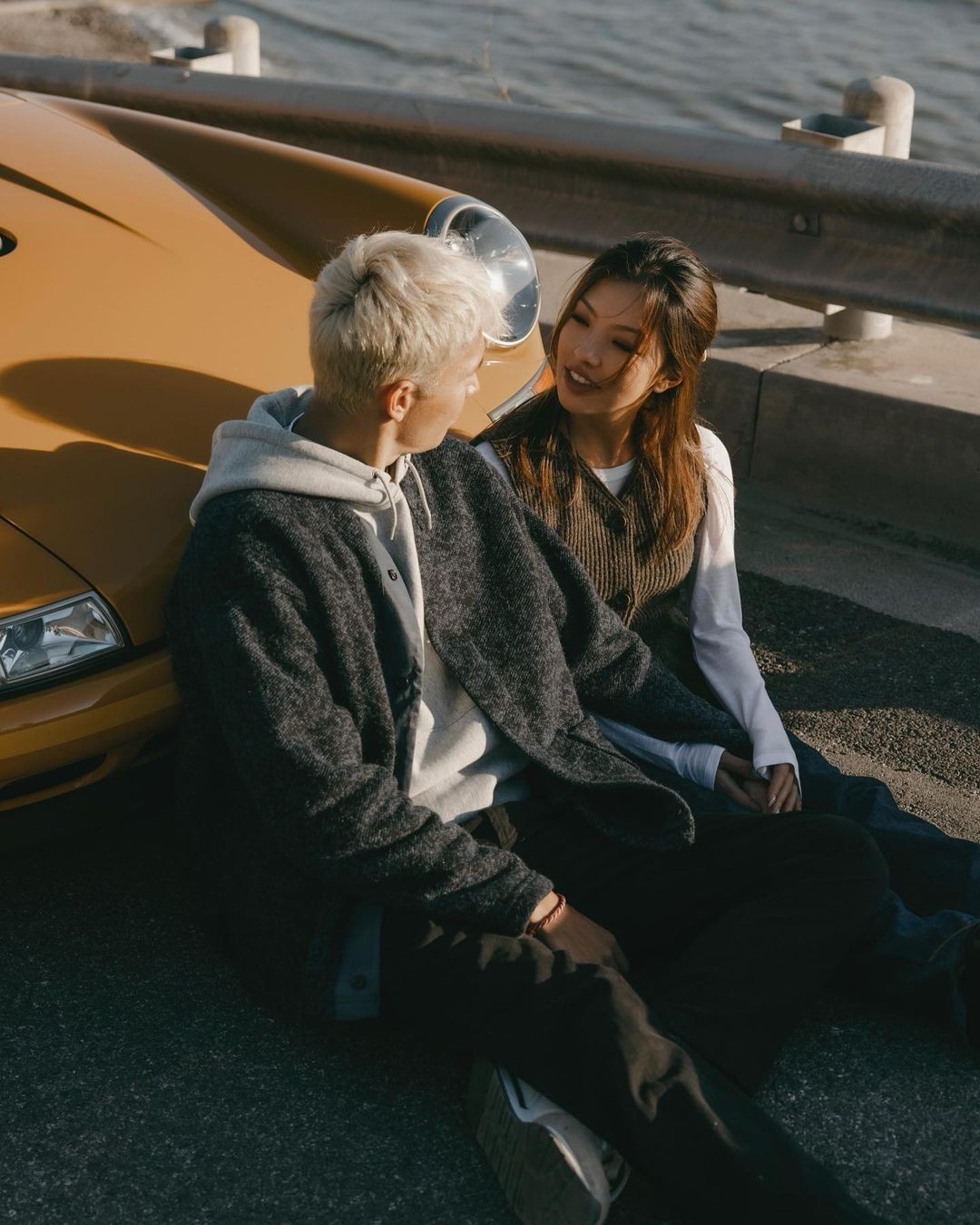 Alex Albon and his girlfriend with his Porsche 911.