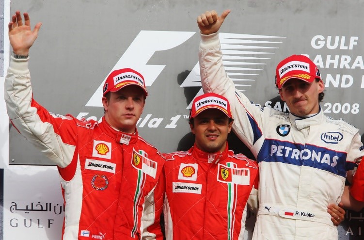 Second placed Kimi Raikkonen, Ferrari race winner Felipe Massa and third placed Robert Kubica celebrate on the podium after winning the Bahrain F1 Grand Prix at the Bahrain International Circuit on April 6, 2008 in Sakhir.