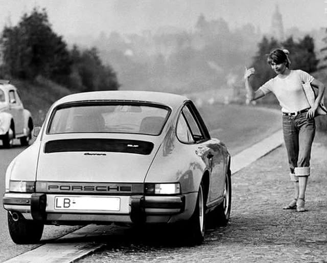 A girl and a Porsche.