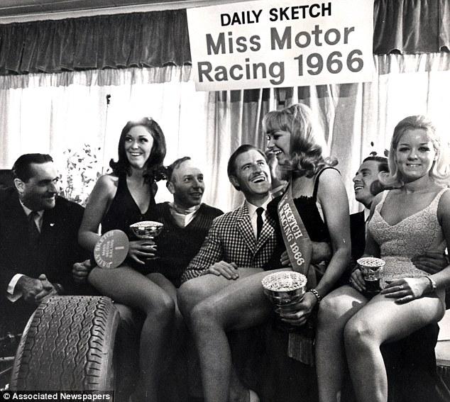 John Surtees, Graham Hill, Jim Clark and three girls.