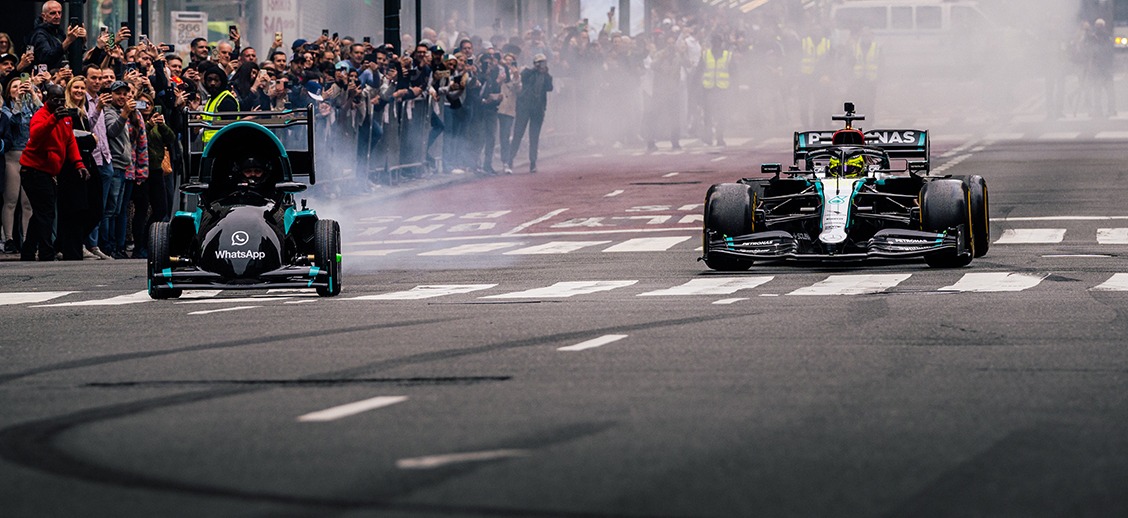 Demo run down Fifth Avenue… accompanied by a life-sized replica of the emoji race car.