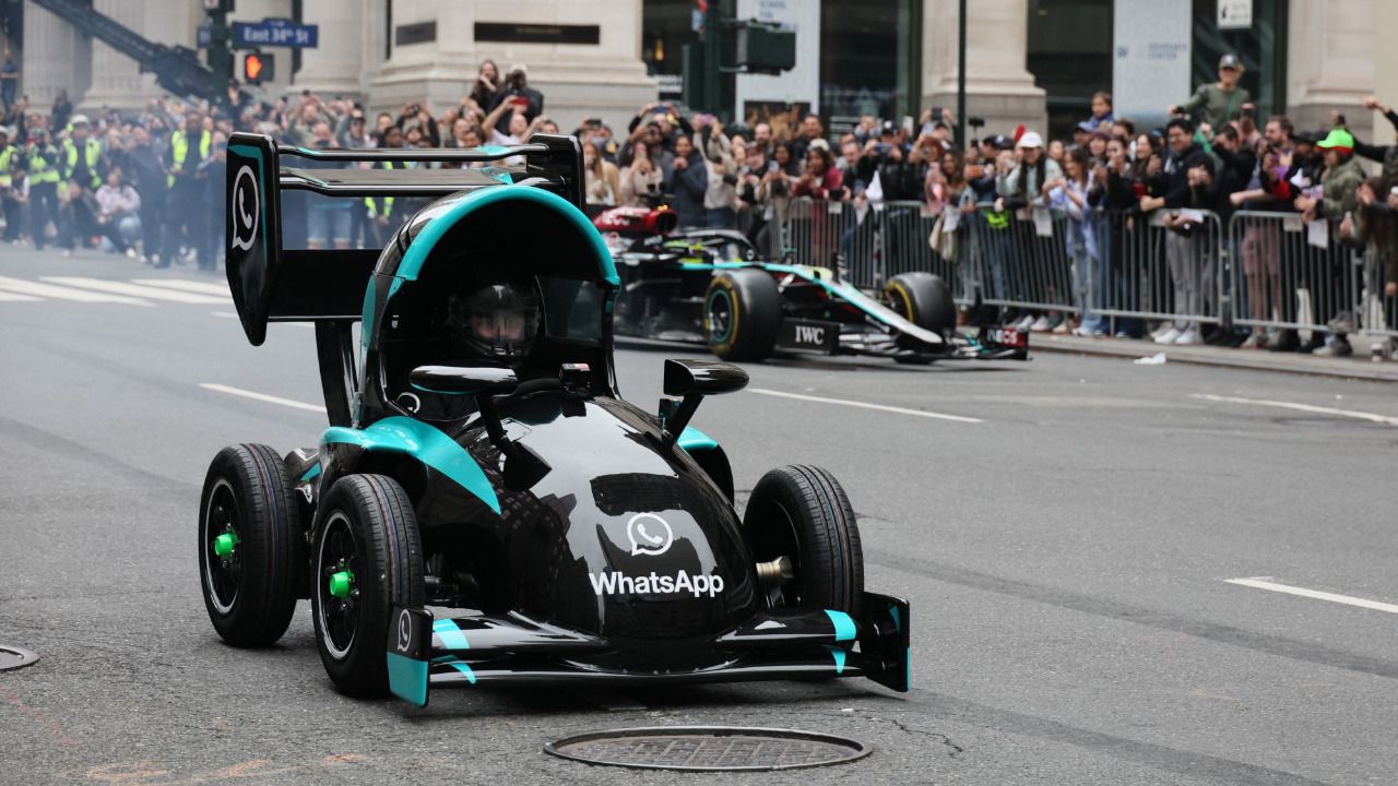 Demo run down Fifth Avenue… accompanied by a life-sized replica of the emoji race car.