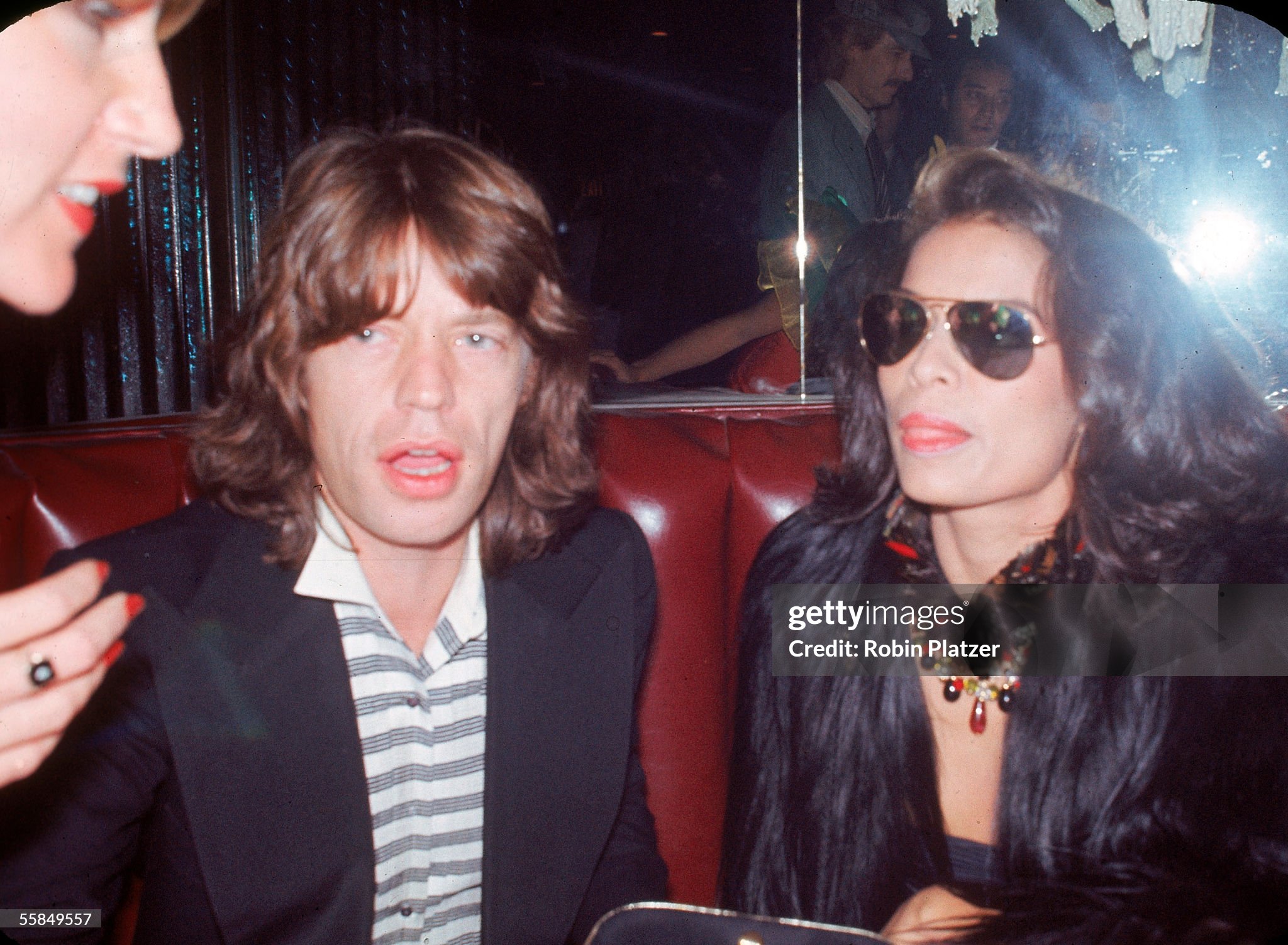 Mick Jagger sits with his wife, Nicaraguan-born model and activist Bianca, early 1980s. 