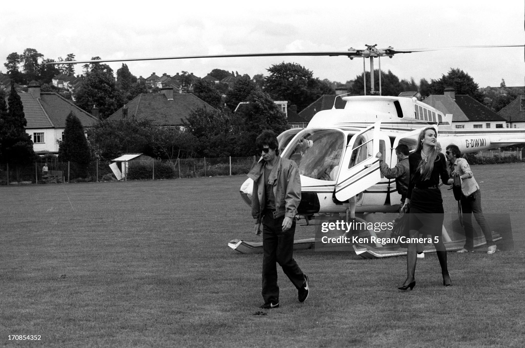 Mick Jagger and Jerry Hall are photographed for the July 19, 1982 issue of People Magazine on June 25 - 26, 1982 backstage at Wembley Stadium in London, England. 