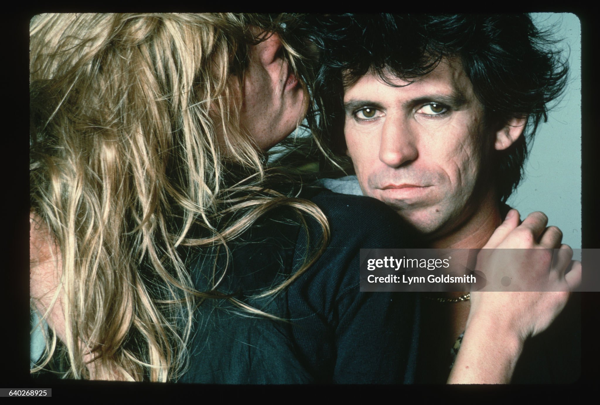 Model Patti Hansen embraces her husband, Keith Richards, guitarist for the British rock & roll band, The Rolling Stones, around 1981. 