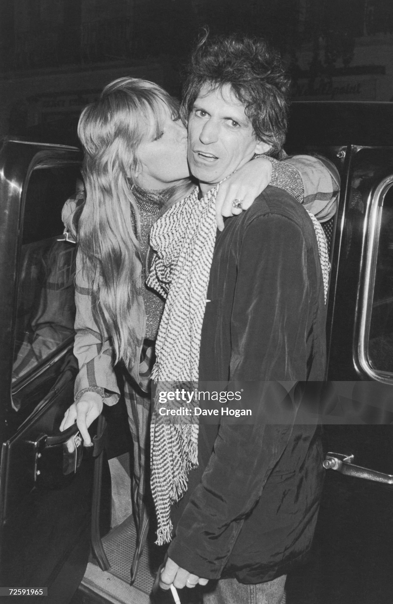 Guitarist Keith Richards of the Rolling Stones arrives at the San Lorenzo restaurant in London with his wife Patti, circa 1985.