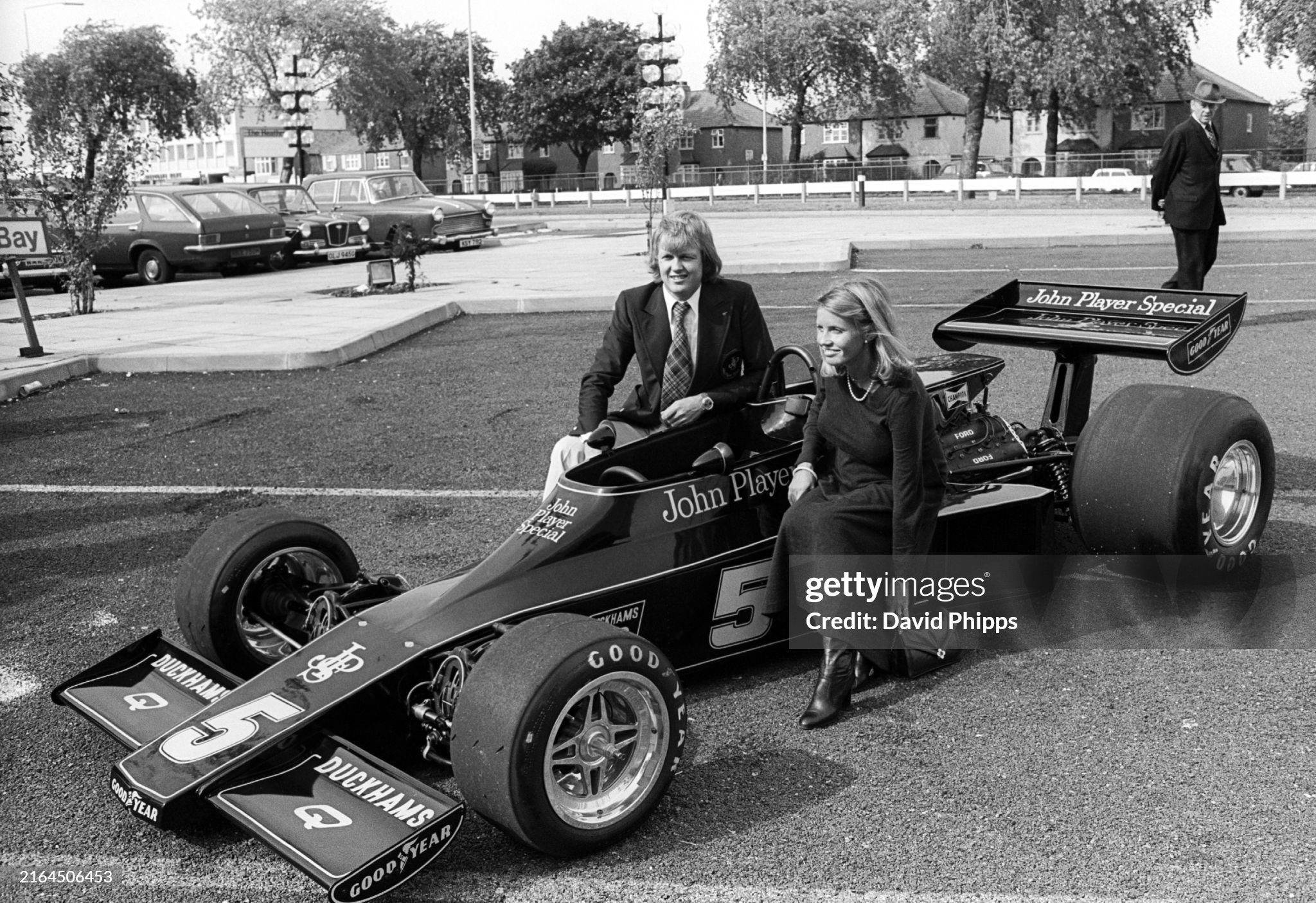 Ronnie and Barbro Peterson at the launch of the new Lotus 77, held in a car park, in England in 1975. 