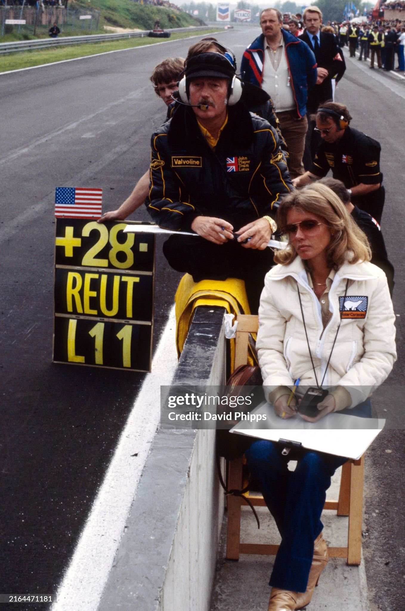 Colin Chapman and Barbro Peterson follow the progress of race winner Mario Andretti and Ronnie Peterson, who finished second, at the Belgian Grand Prix in Zolder on 21 May 1978. 