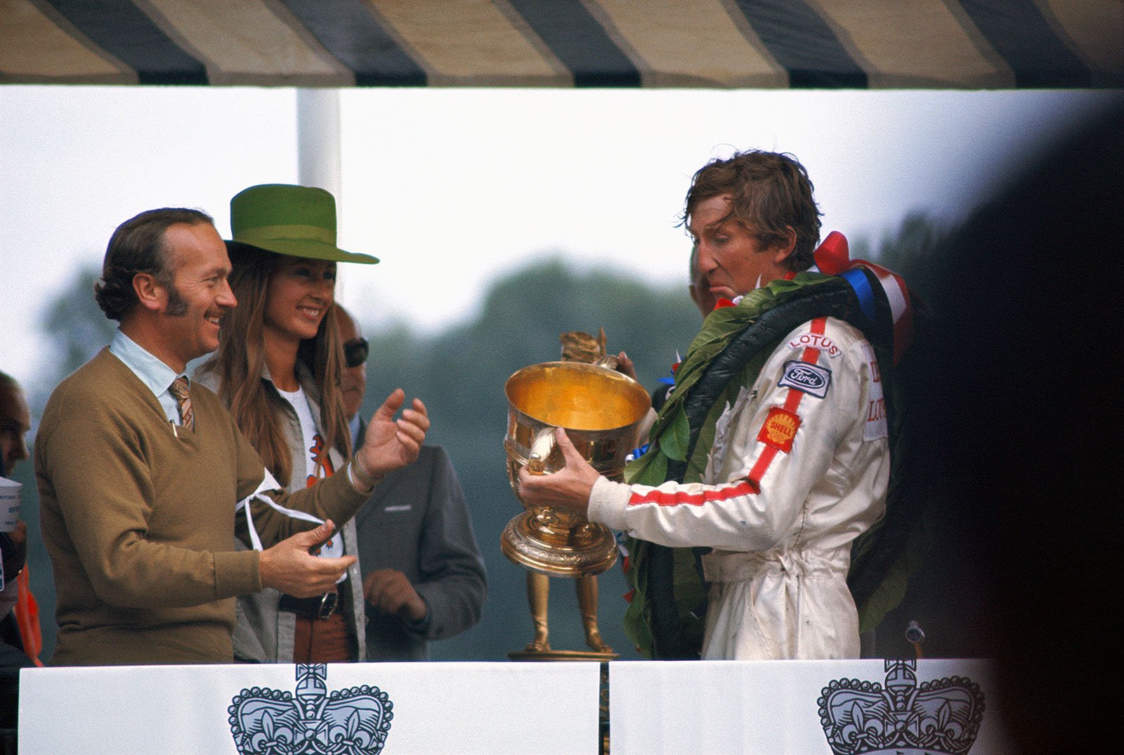 Jochen and Nina Rindt with Colin Chapman during the podium ceremony at Brands Hatch in 1970. 
