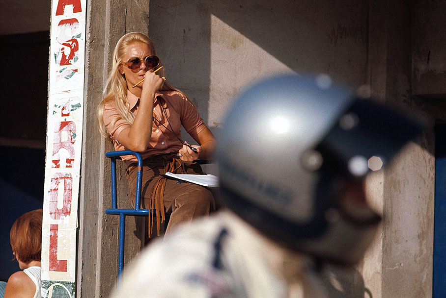 Pedro Rodriguez' (foreground with helmet) English girlfriend Glenda takes the lap times at the 1970 Italian Grand Prix in Monza. 