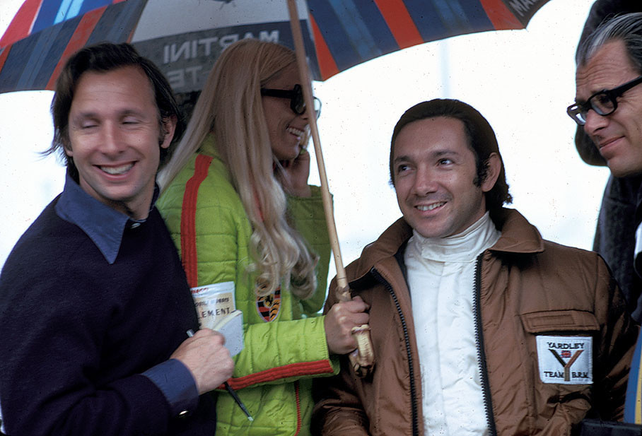 Pat McNally laughs with Pedro Rodriguez at Monaco in 1971. 