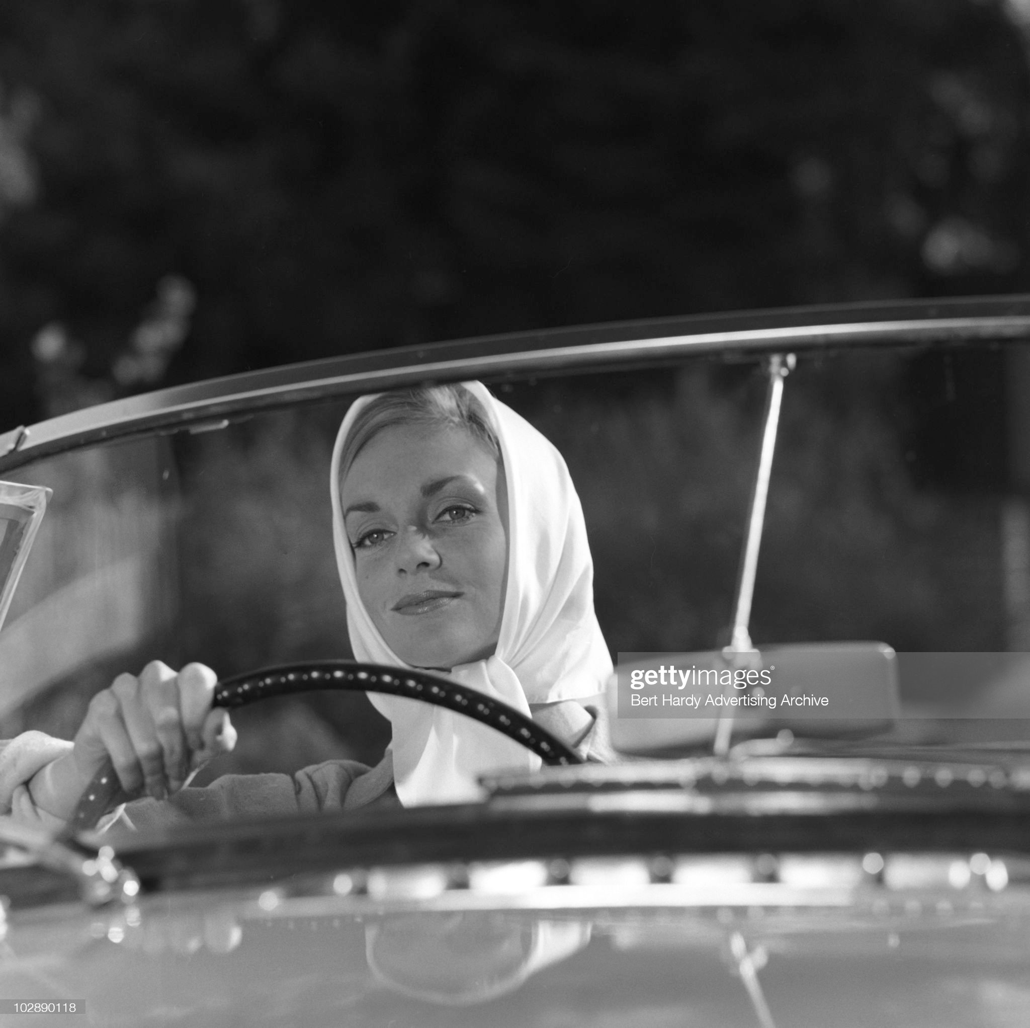 A woman driving an MG sports car, Bickley, Kent, 25th October 1962.