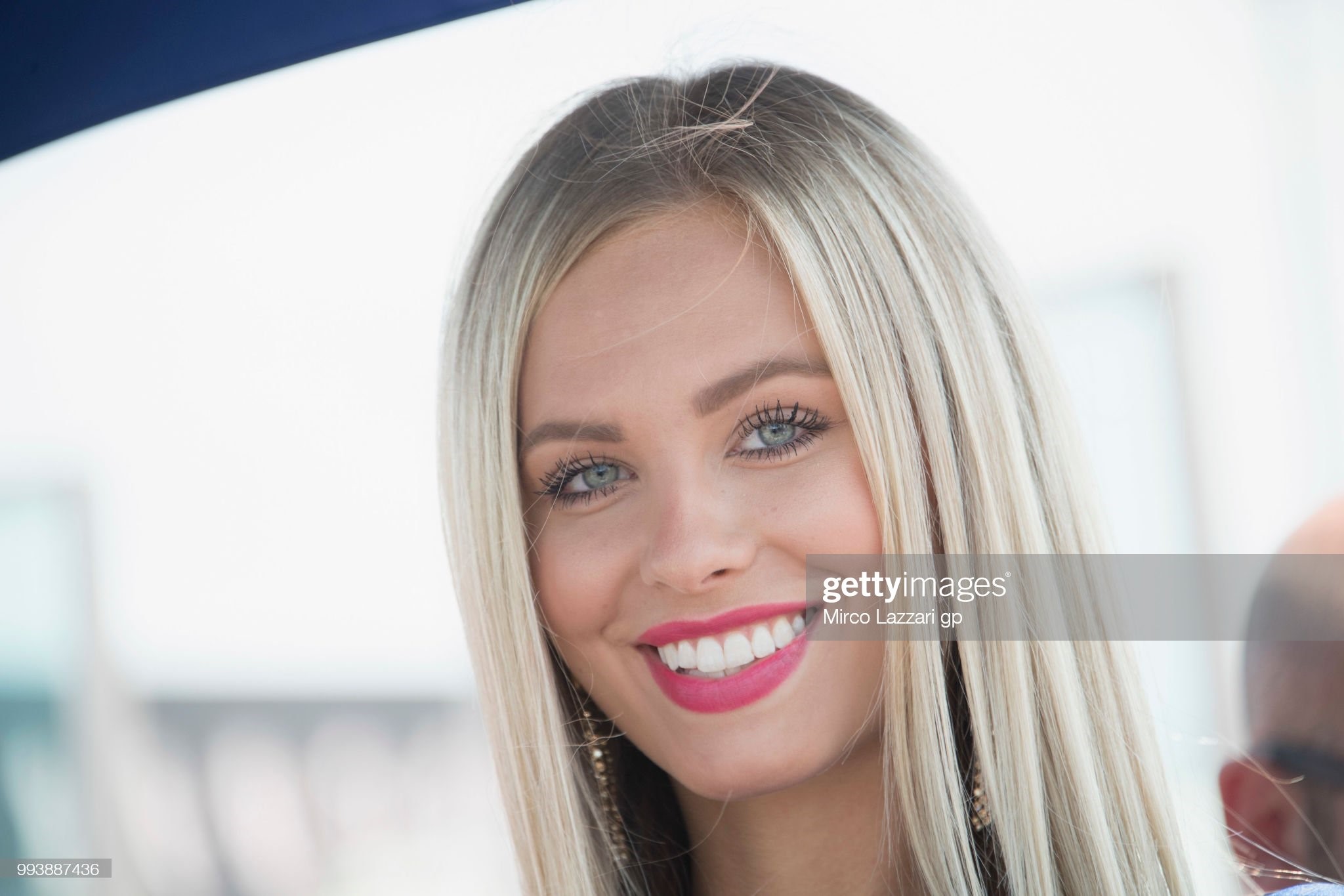 The grid girl smiles on the grid during the Superbike race 2 during the WorldSBK Riviera di Rimini race on July 08, 2018 in Misano Adriatico, Italy. 