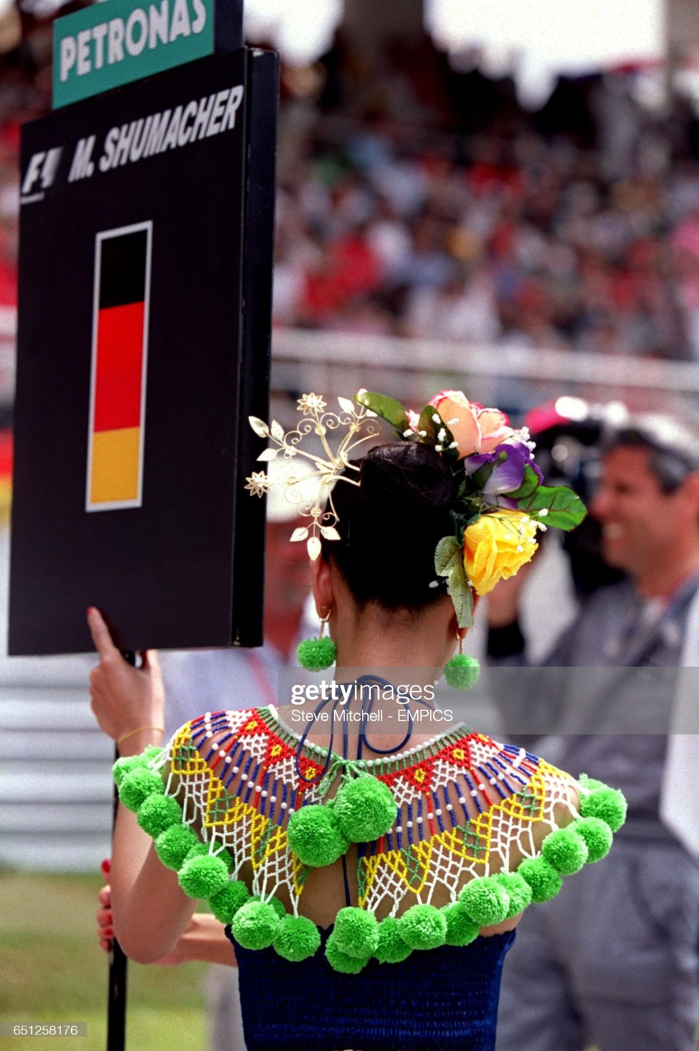 Michael Schumacher's grid girl takes her place at the Malaysian Grand Prix on March 18, 2001. 