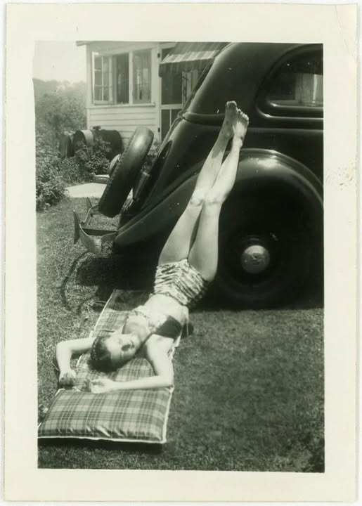 A vintage woman and a car.