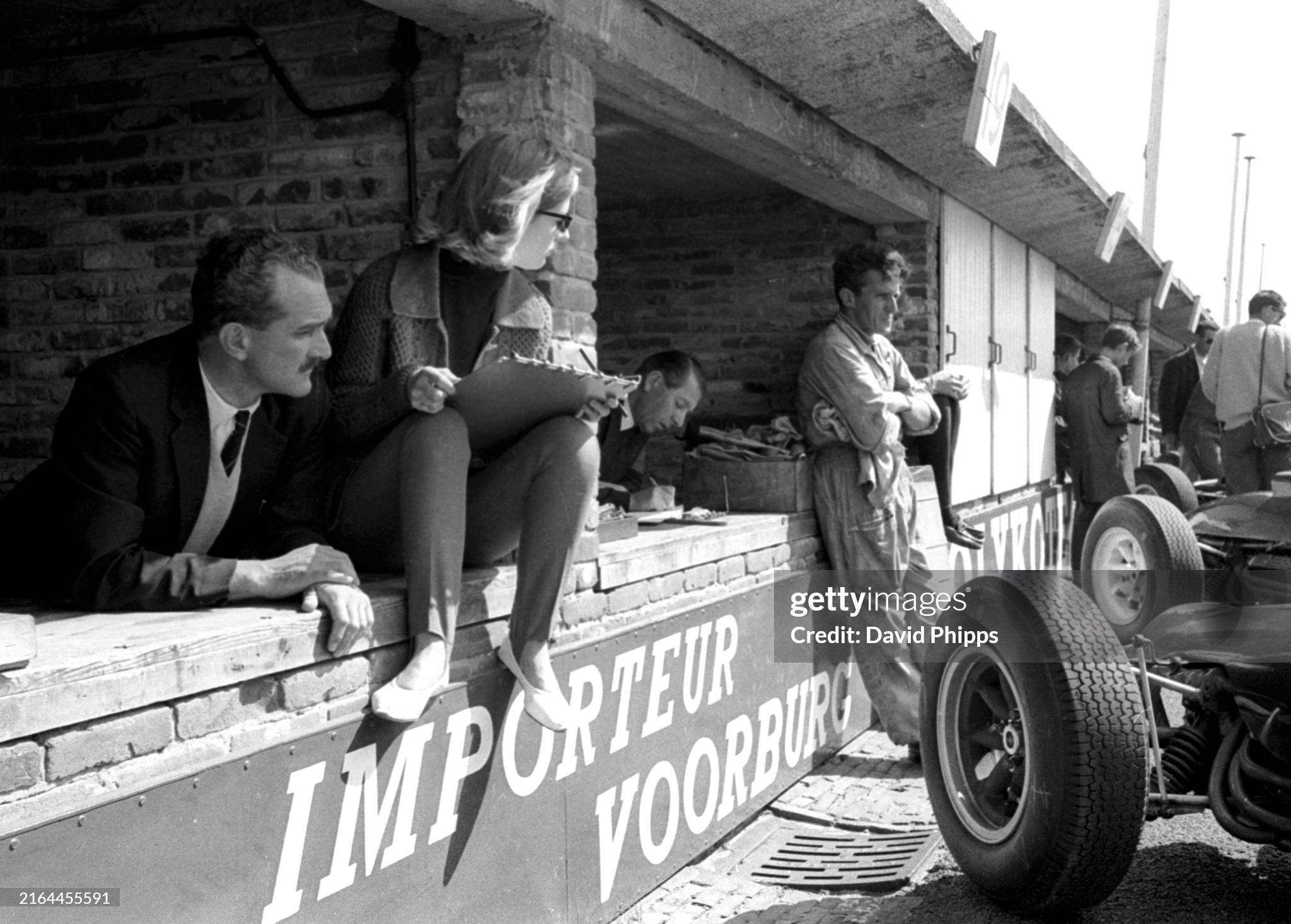 Marianne Bonnier, wife of Jo Bonnier, Cooper, charts her husband's lap times from the pits at the Dutch Grand Prix in Zandvoort, Holland, on 23 June 1963. 
