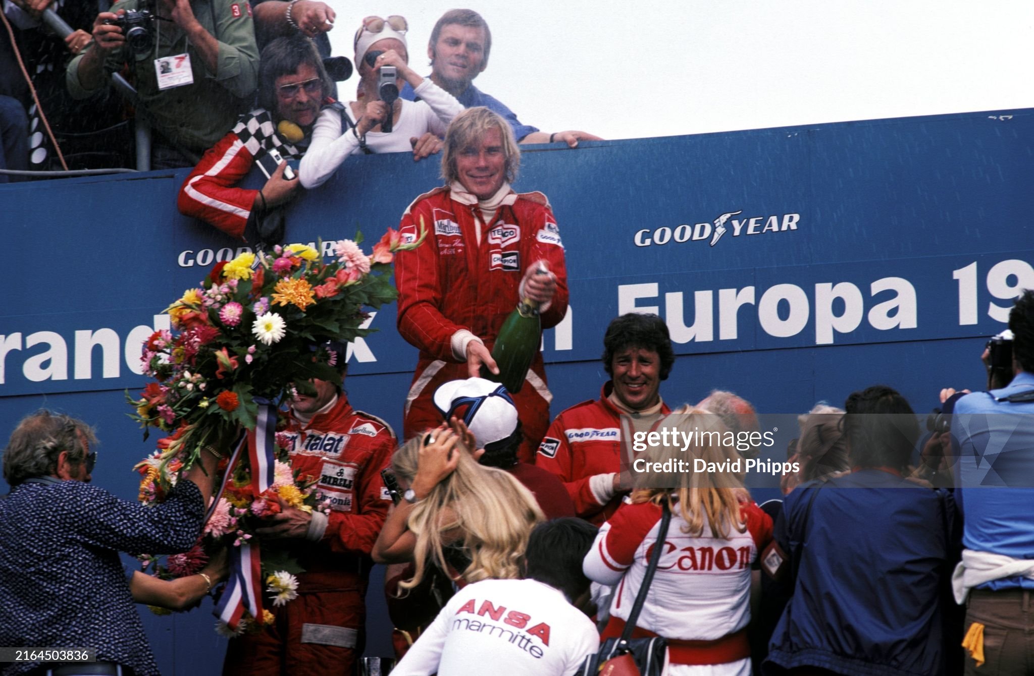 Race winner James Hunt, McLaren, celebrates on the podium with Clay Regazzoni, Ferrari 312T2, 2nd position and Mario Andretti, Lotus 77-Ford, 3rd position, after the Dutch Grand Prix at Zandvoort on 29 August 1976. 