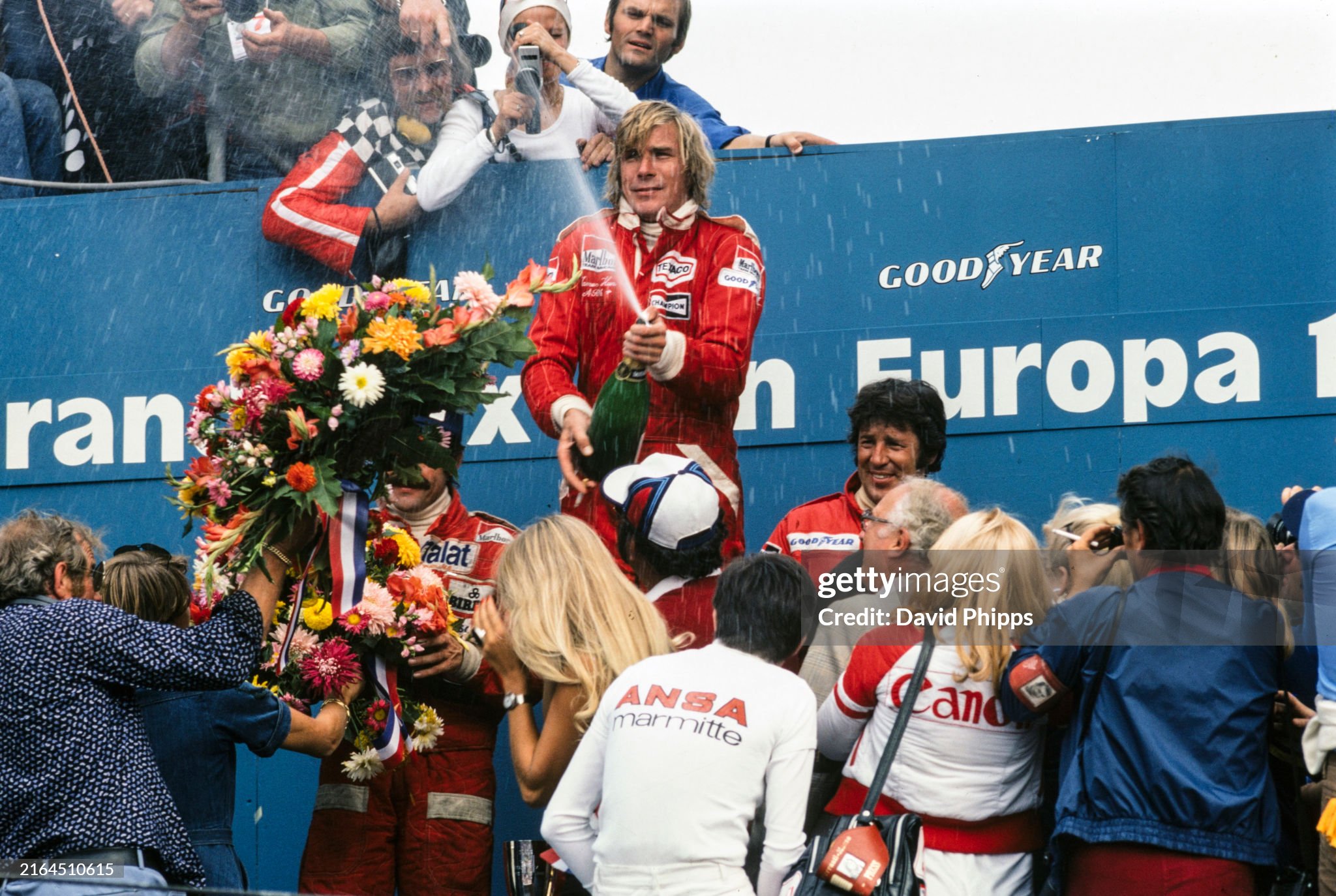 Race winner James Hunt, McLaren, celebrates on the podium with Clay Regazzoni, Ferrari 312T2, 2nd position and Mario Andretti, Lotus 77-Ford, 3rd position, after the Dutch Grand Prix at Zandvoort on 29 August 1976. 