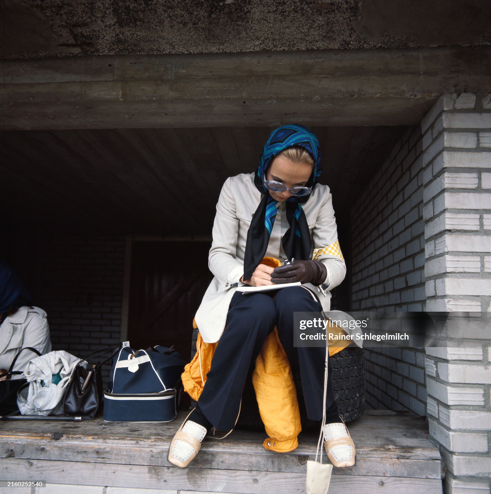 A lady with a stopwatch taking the lap times in the pits during the Dutch Grand Prix at Zandvoort on 23 June 1968. 