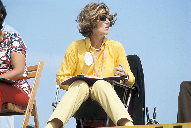 Rob Walker's wife Betty keeps the times above the pits at the Dutch Grand Prix in 1970. 