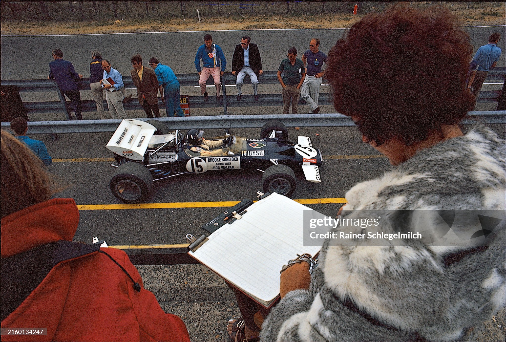 Bette Hill keeps her husband's times whilst he passes her in pit lane during the Dutch Grand Prix at Zandvoort on June 21, 1970. 