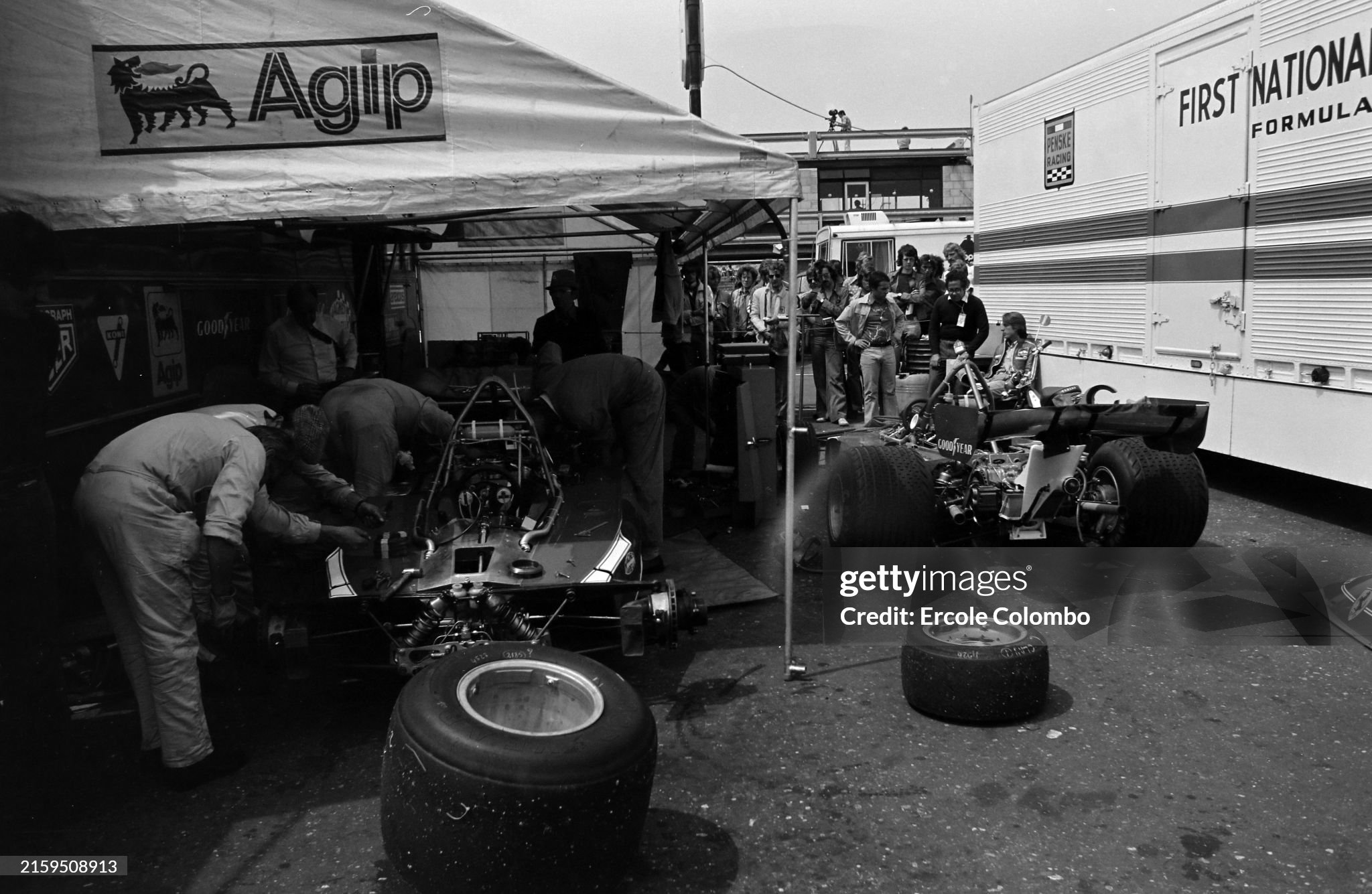 Mechanics working on a Ferrari 312T under the awning at the Dutch Grand Prix in Zandvoort, Holland, on 22 June 1975. 