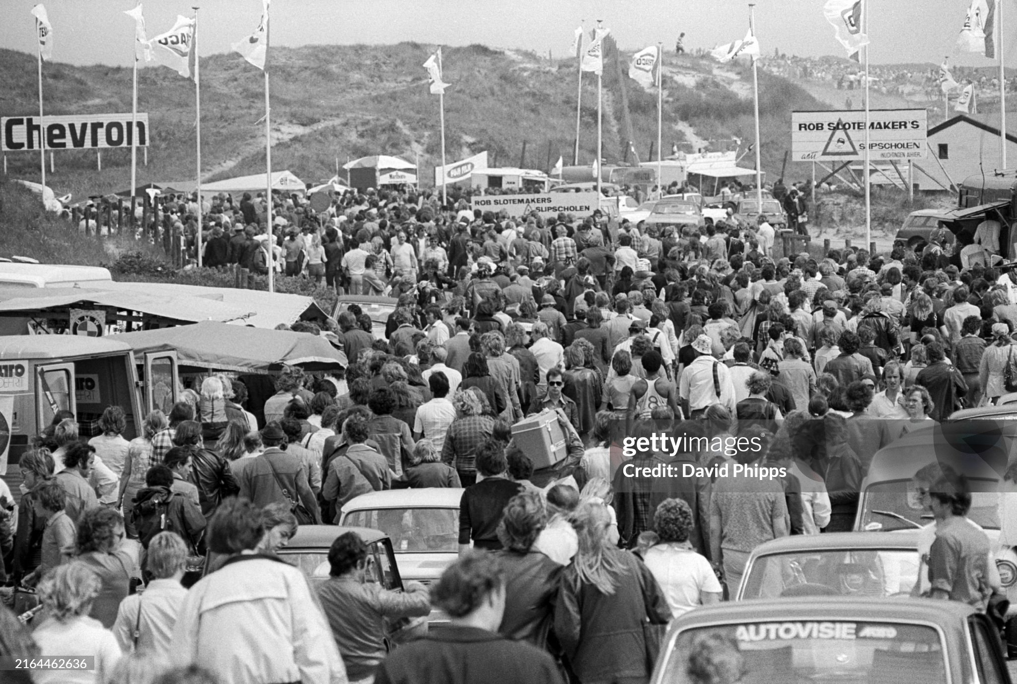 The crowd pour into the circuit before the start of the Dutch Grand Prix in Zandvoort, Holland, on 22 June 1975. 