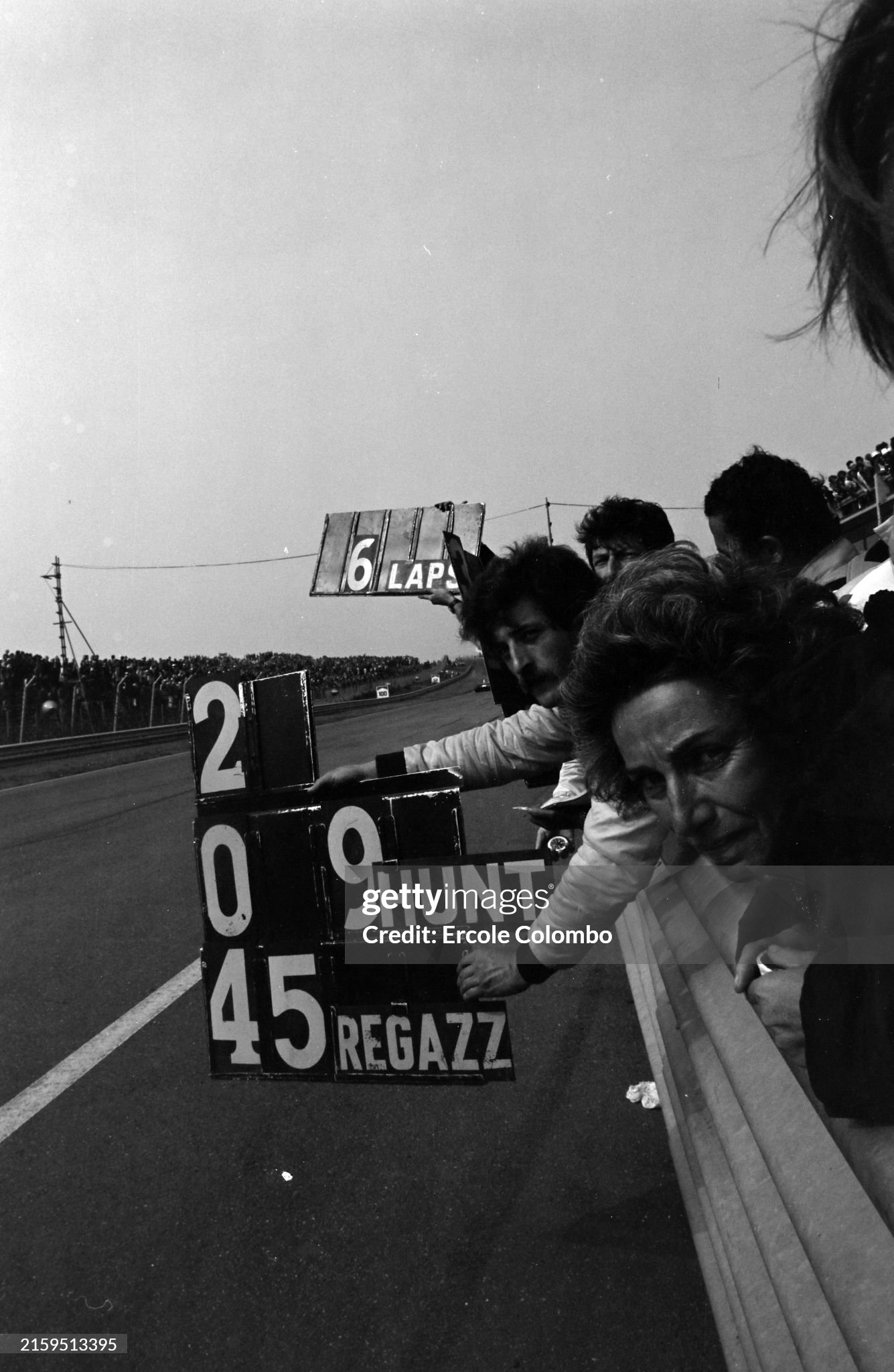 A mechanic hangs out a pitboard during the Dutch Grand Prix in Zandvoort, Holland, on 22 June 1975. 