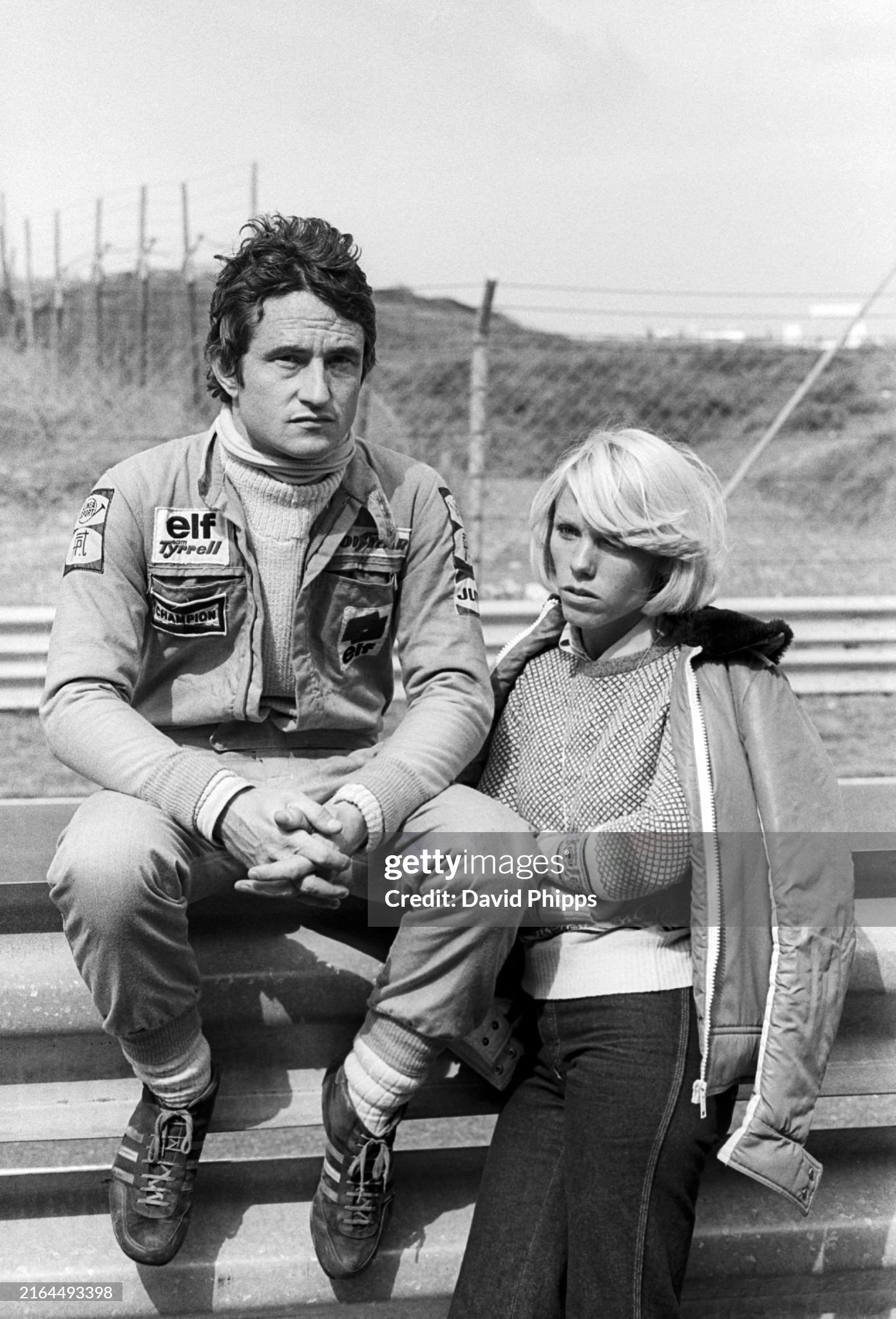 Seventh placed Patrick Depailler, Tyrrell, sits on the pit wall barrier with his wife Michelle Depailler during the Dutch Grand Prix at Zandvoort on 29 August 1976. 