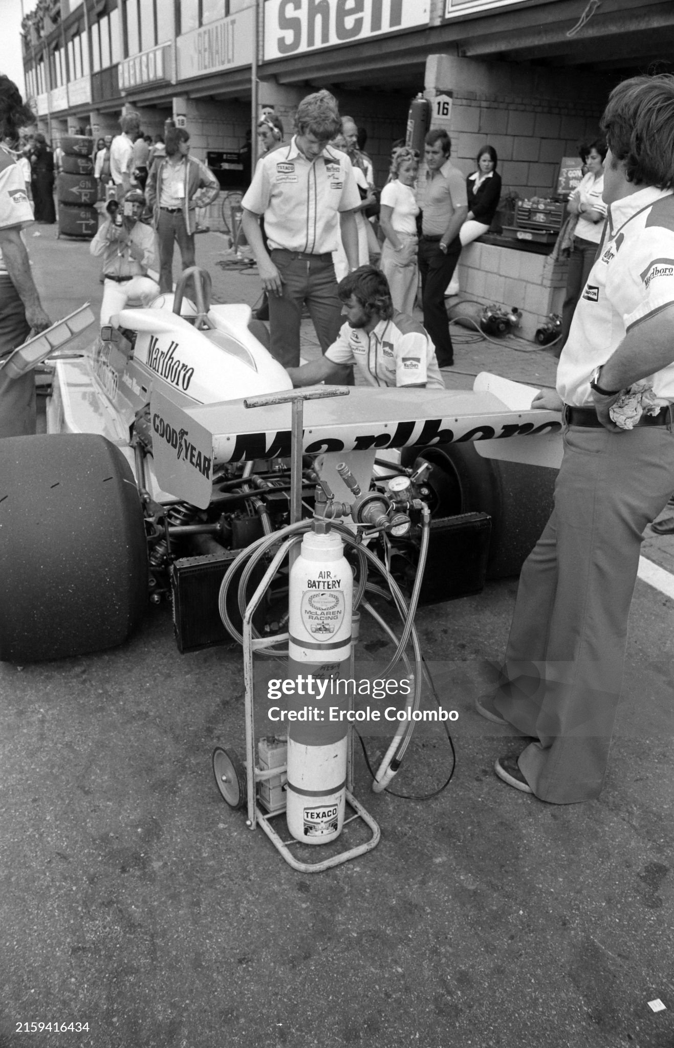 Mechanics hover around Jochen Mass, McLaren M26 Ford, in the pits during the Dutch Grand Prix at Zandvoort on 29 August 1976. 